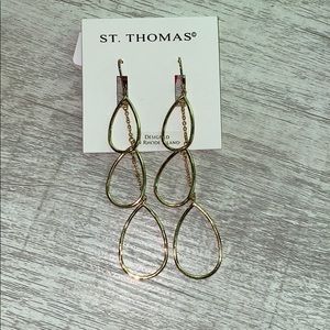 Gold dangle earrings.